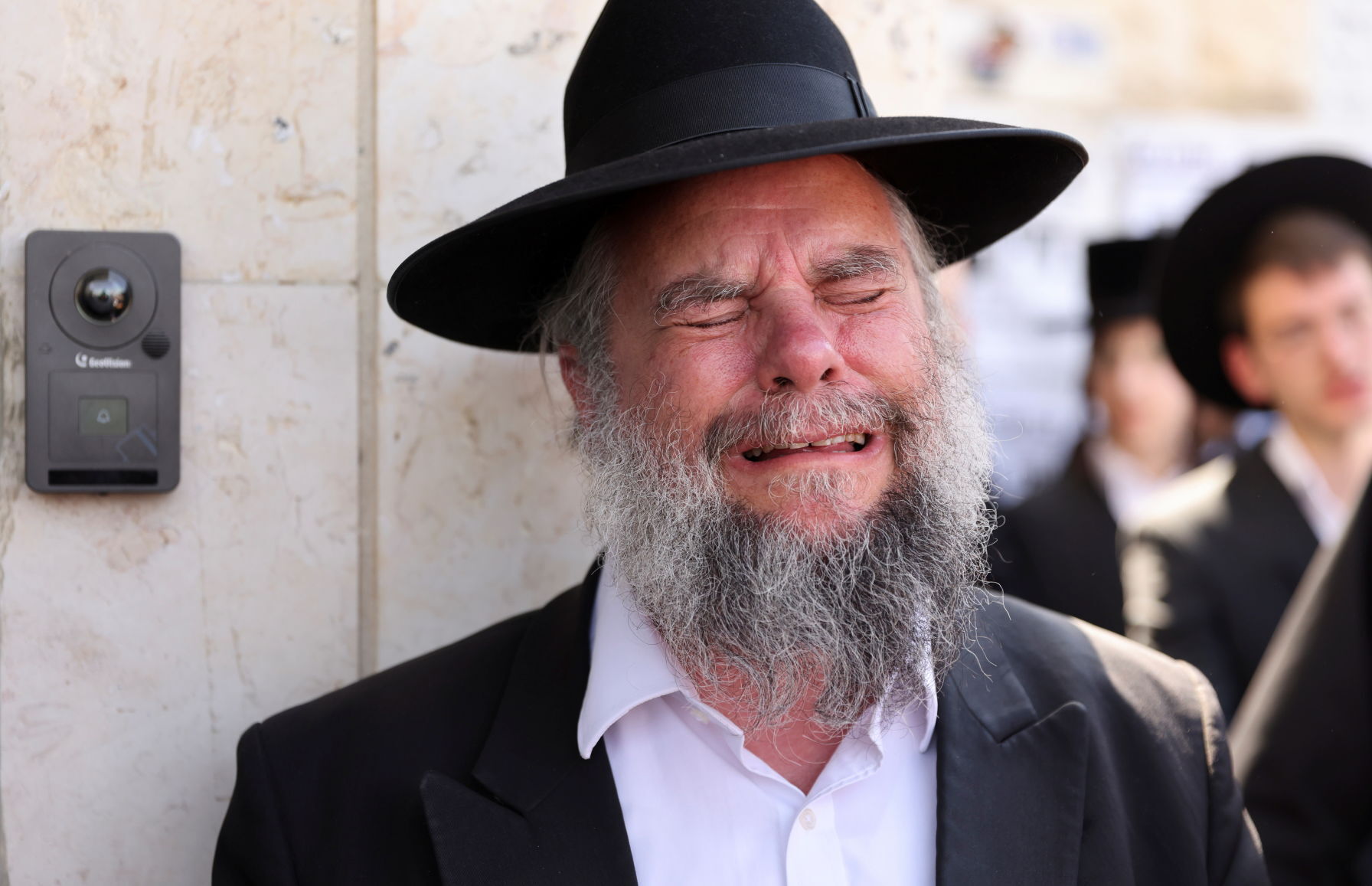 Ultra-Orthodox Jewish men take part in a funeral for Rabbi Elazar Goldberg in Jerusalem